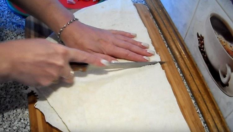 Thin pita bread is cut into 4 parts.