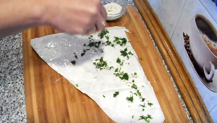 Sprinkle the cheese layer with herbs.