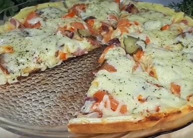 Simple and tasty pizza on mayonnaise and sour cream in a pan: we cook according to a step by step recipe with a photo.