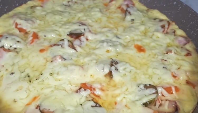 The edges of the pizza should be browned and the cheese should be melted.