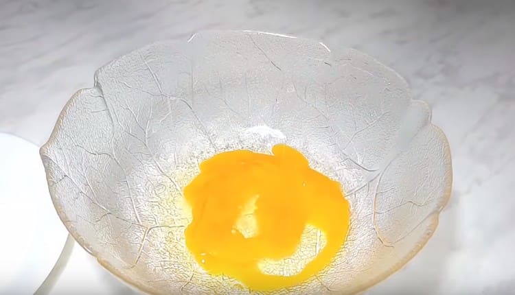 Eggs are beaten into a bowl.