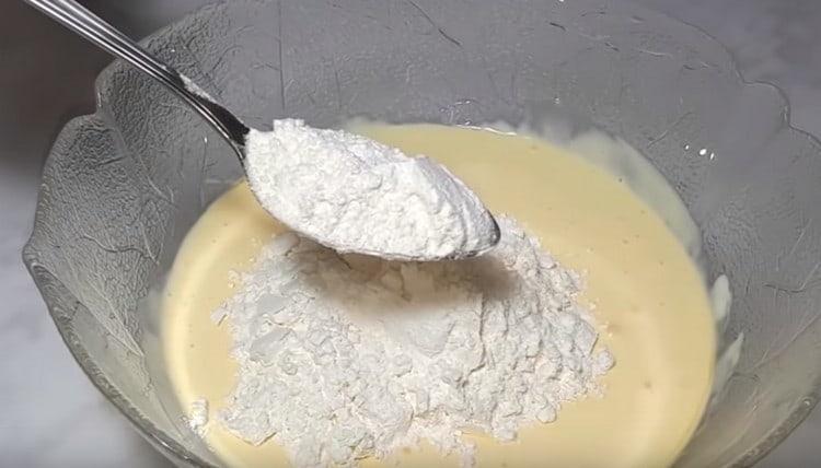 Add flour to the liquid components.