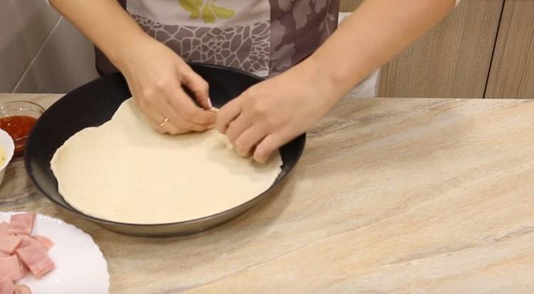 Put the dough in a dry cold pan.