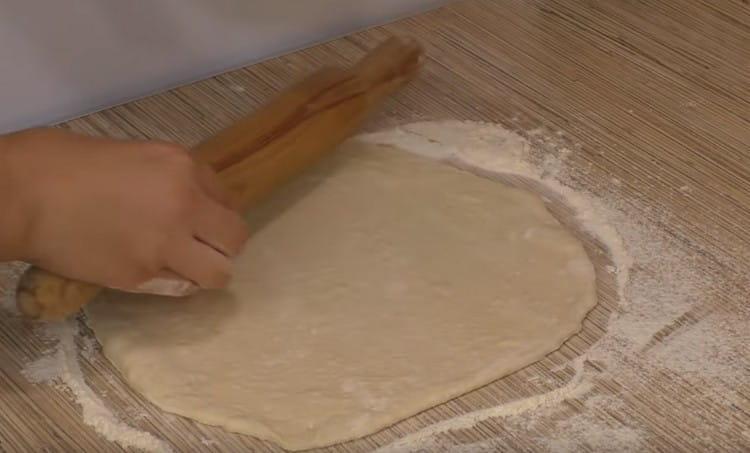 Divide the dough in half and roll each part into a circle.