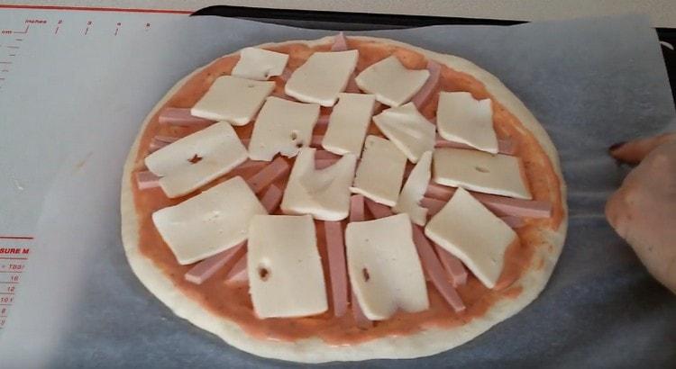 Gently pull the pizza onto a baking sheet.