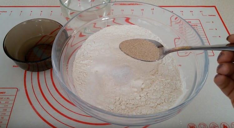 Add salt, sugar, yeast to the flour.
