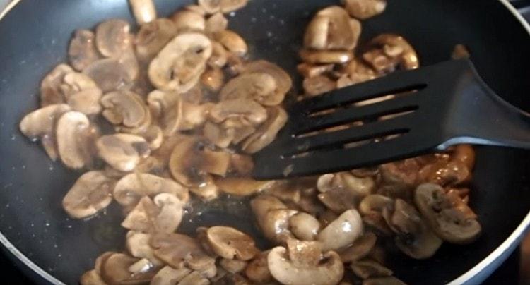 Fry the mushrooms in a pan until the moisture evaporates.