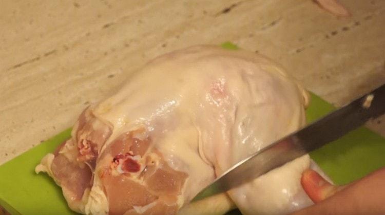 We chop the chicken carcass.