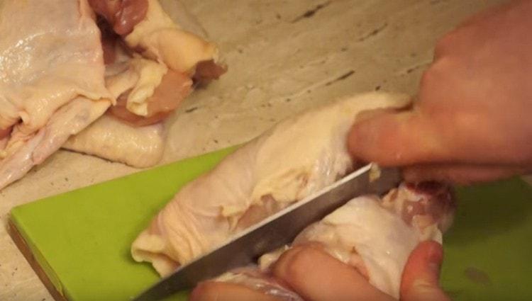 Separate the chicken breast from the back and frame.