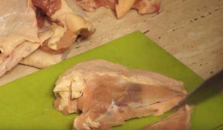 We cut the chicken breast into several parts.