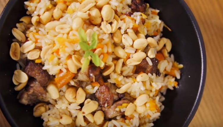 Sprinkled pilaf with pork and dried apricots and serve with salted peanuts.