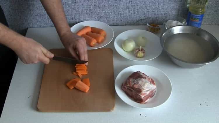 According to the recipe, for cooking pilaf in a slow cooker, cut carrots