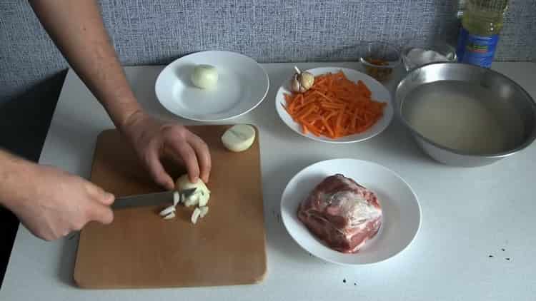 According to the recipe, to cook pilaf in a slow cooker, chop onions