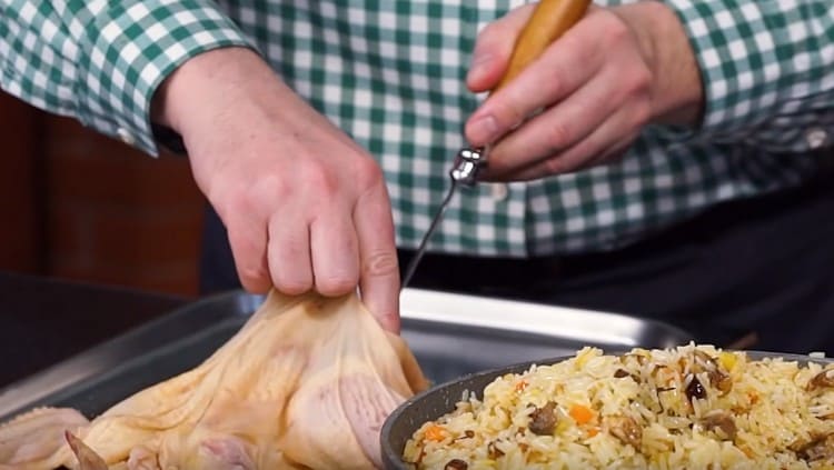 The resulting pilaf is stuffed with chicken skin.