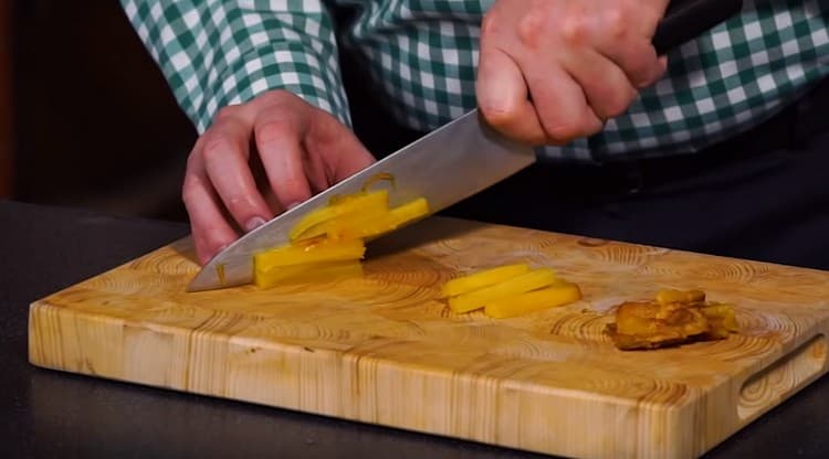 Peel the carrots from a golden stick and chop.