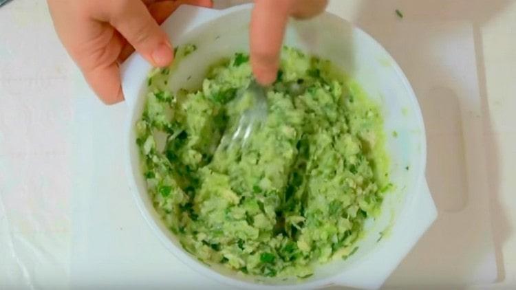 Add crumbled onions and greens to the avocado puree.