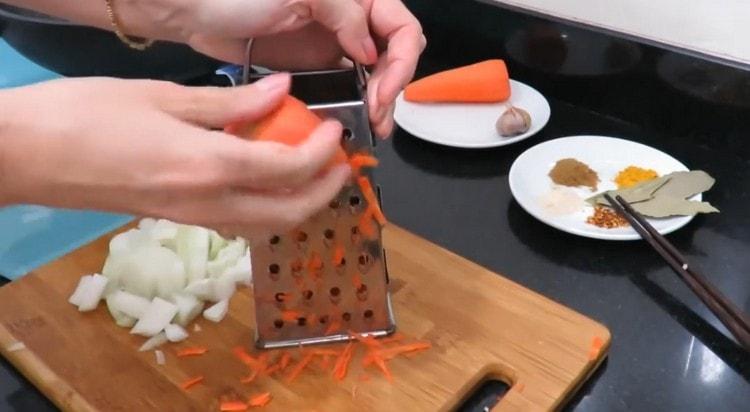 Grate carrots, cut onions.