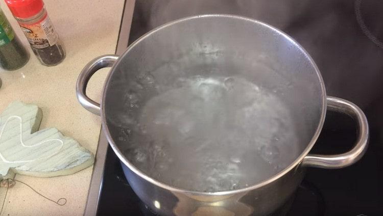 In a saucepan, boil water.
