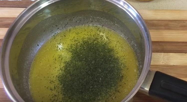 Add dried greens to the melted butter.