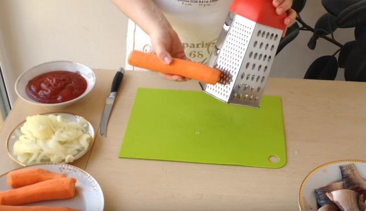Three carrots on a grater.