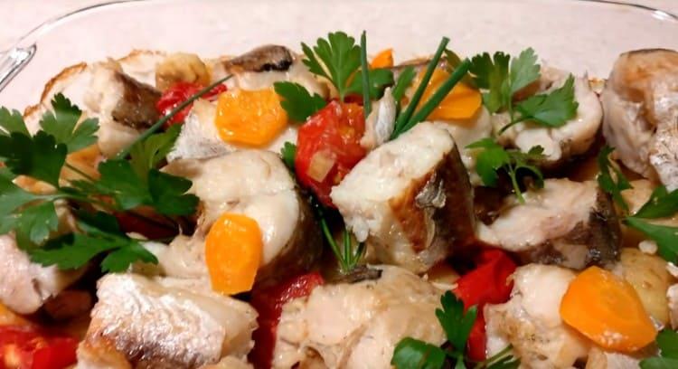 Fish with vegetables in the oven is very tender and tasty.