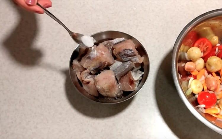 Sprinkle slices of hake with salt and pepper.