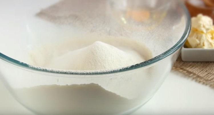 Sift flour into a bowl, add salt.