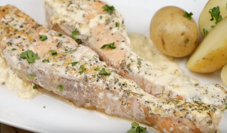 Salmon in a creamy sauce is very juicy and tender.