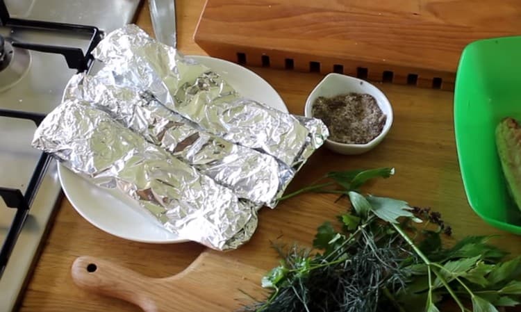 We send the fish in foil to the oven.