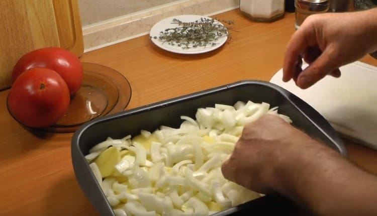 Lay onions on top of potatoes.