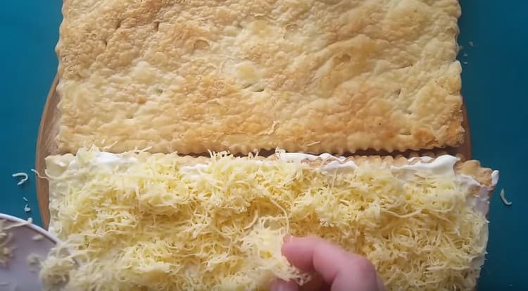 Sprinkle this layer with grated cheese.