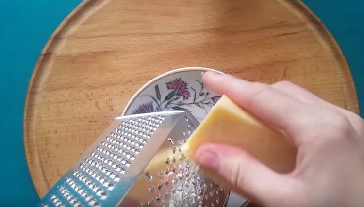 On a fine grater we rub hard cheese.