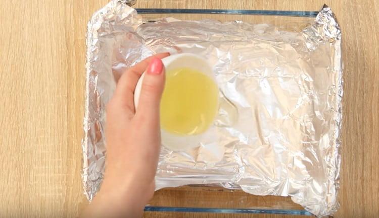 Cover the baking dish with foil and grease it with vegetable oil.