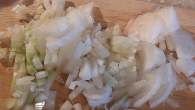 We chop the onion with a knife.