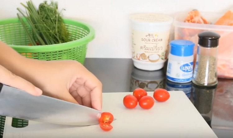 We cut each cherry tomato into several pieces.