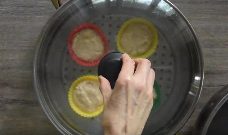 Cooking fish souffle in a double boiler.