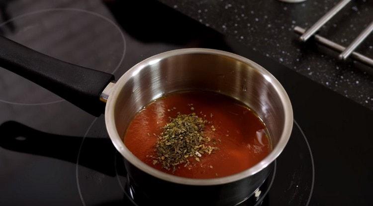 Pour olive oil, grated tomatoes, salt, aromatic herbs into the stewpan.