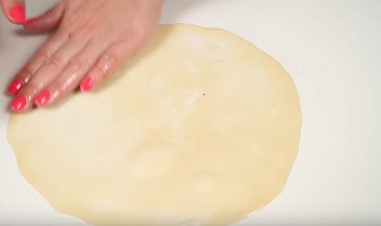 You need to stretch the dough as finely as possible.