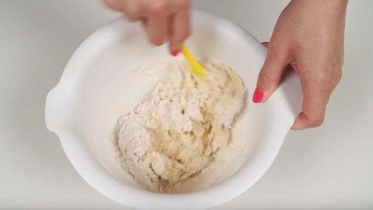 Mix the dough with a spatula.