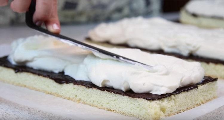 We spread the same amount of cream on each cake.