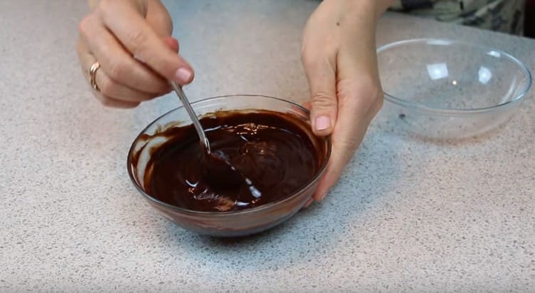 We make the icing by melting the chocolate with butter in the microwave and mix it.