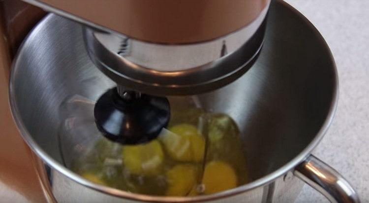 Beat the eggs with a mixer.