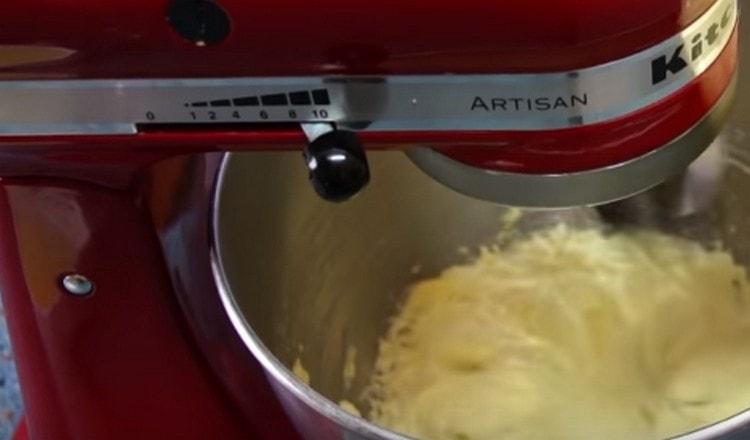 Beat butter with a mixer.