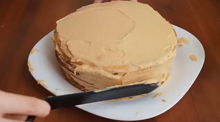 The top and sides of the cake are also coated with cream.