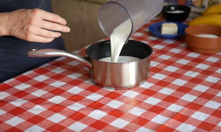 Pour milk into a stewpan and heat.