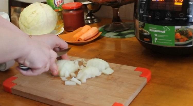 Finely chop the onion and send to the slow cooker.