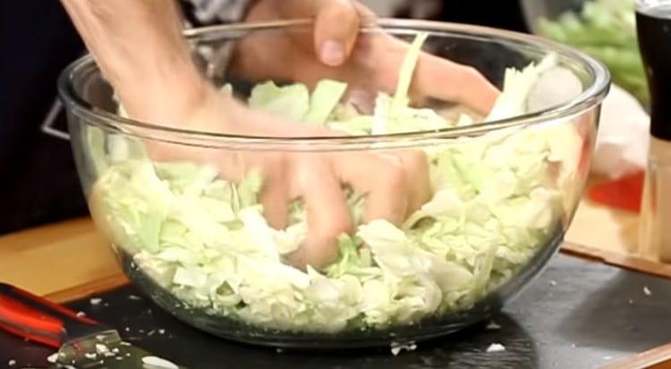 Shred the cabbage and knead it a little with salt.