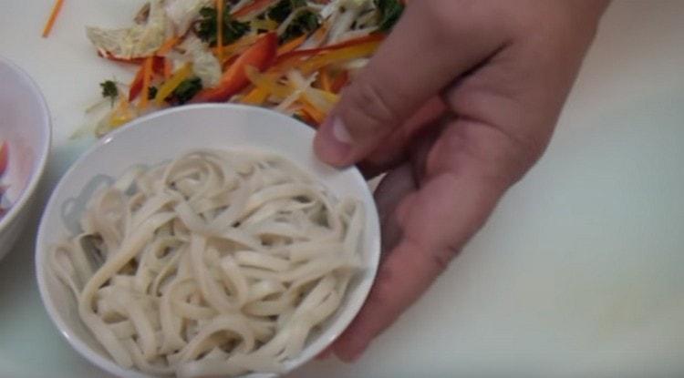 First you need to boil udon noodles.