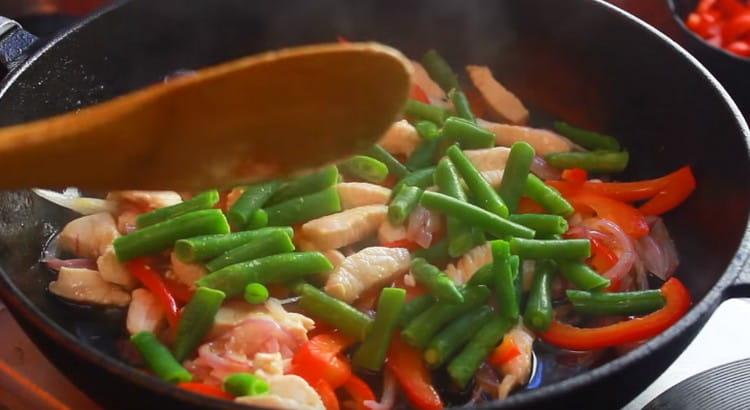 Then put the green beans in the pan.