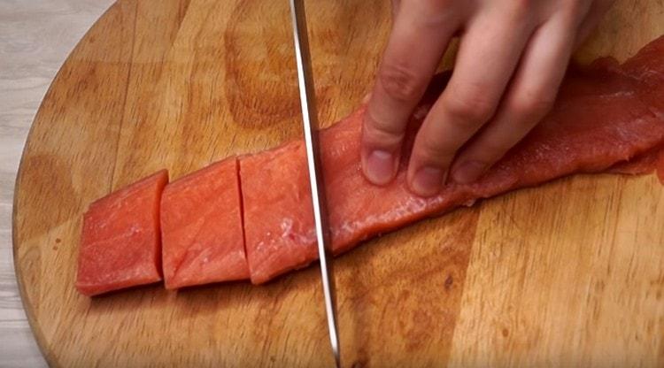 Salmon fillet cut into small pieces.